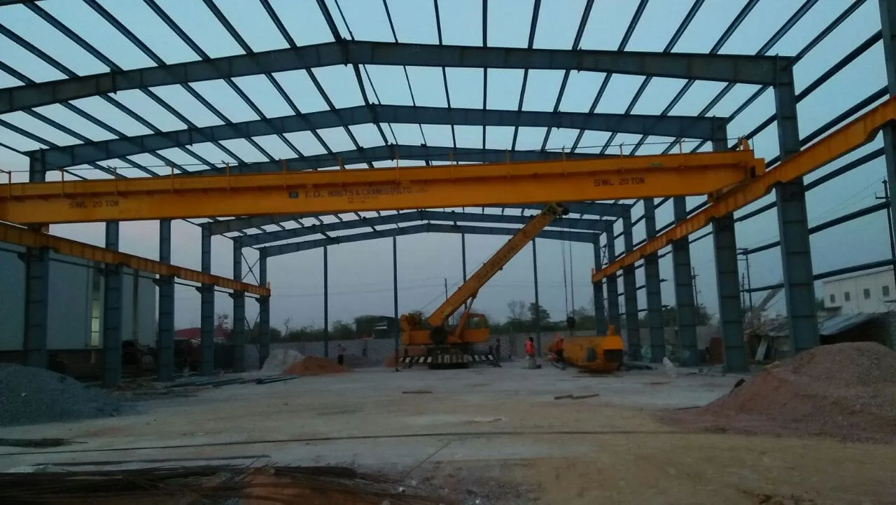EOT crane by J.D. Hoists & Cranes (JDHCPL) inside a steel shed during erection